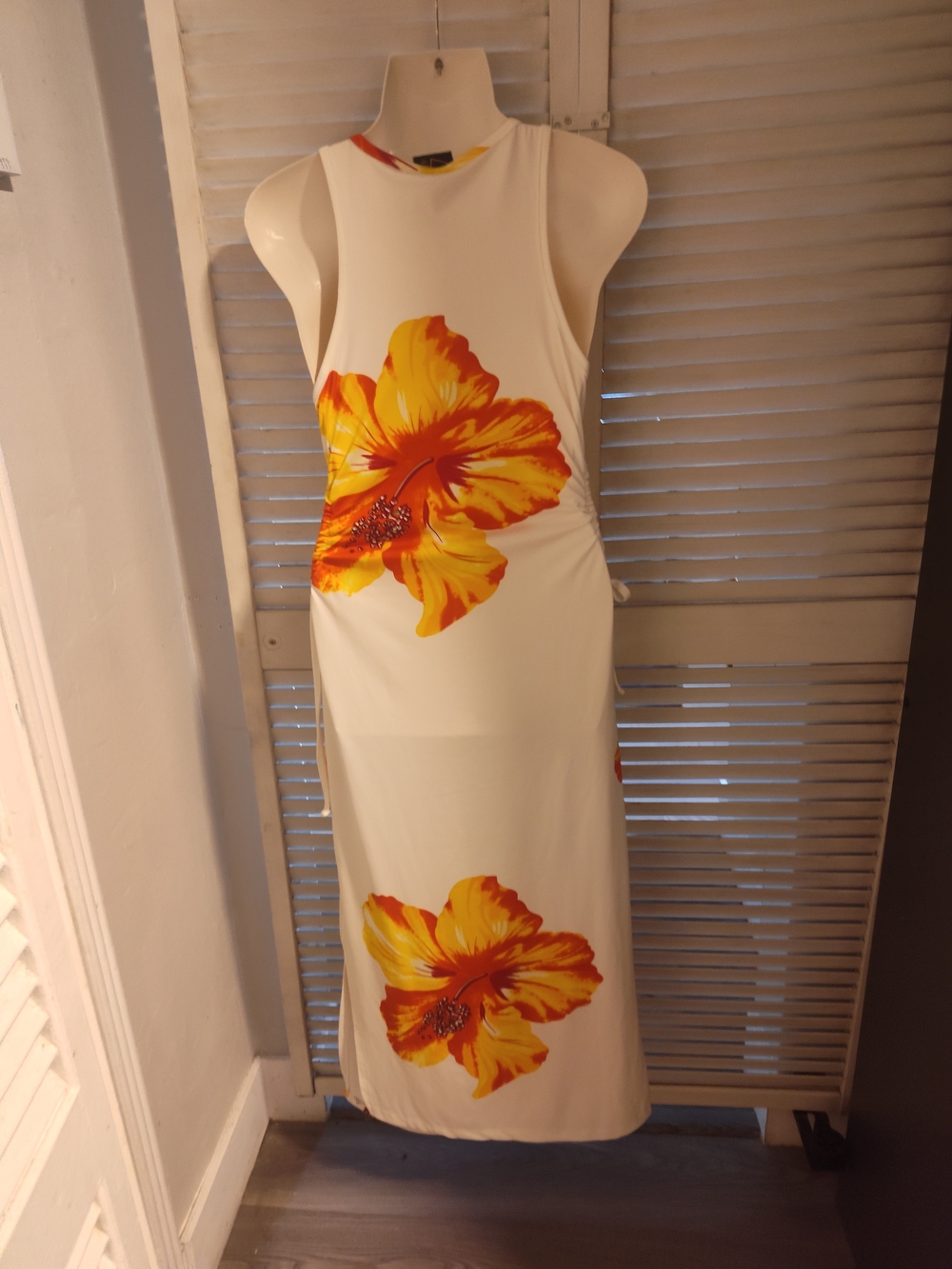 Sleeveless White Maxi Dress with Yellow-Orange Floral Print